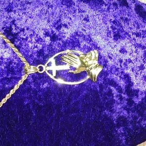 Beautiful cross with rhinestone and hands cradling cross